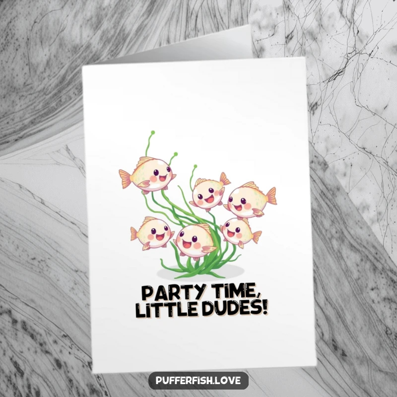 Funny Free Printable Birthday Card featuring tiny, playful pufferfish joyfully chasing a green seaweed strand, full of birthday energy.